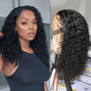 Woman with long, curly hair next to a wig on a mannequin head, Obroi