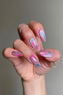 Hand with colorful watercolor nail design on a neutral background, Obroi