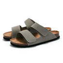 Pair of gray sandals with brown soles on a white background, Obroi