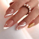 Hand with decorative nail art and a ring on a light background, Obroi