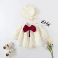 Baby outfit with white dress, red bow, cream shoes, and hat on a light gray background, Obroi