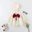Baby outfit with white dress, red bow, cream shoes, and hat on a light gray background, Obroi