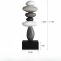 A black rectangular base supporting a stacked stone sculpture in white, light gray, medium gray, and dark gray tones. Measurement annotations show the overall height as 38 cm plus 45 cm, a base width of 15 cm, a base depth of 7 cm, and a side dimension of 15 cm, Obroi