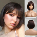 A dark brown bob wig with straight bangs shown on a woman's face in a close-up, alongside two mannequin views showing the front and back of the wig, Obroi
