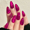 Hand with bright pink nail polish on a neutral background, Obroi