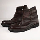 Pair of brown leather boots with buttons on a white background, Obroi