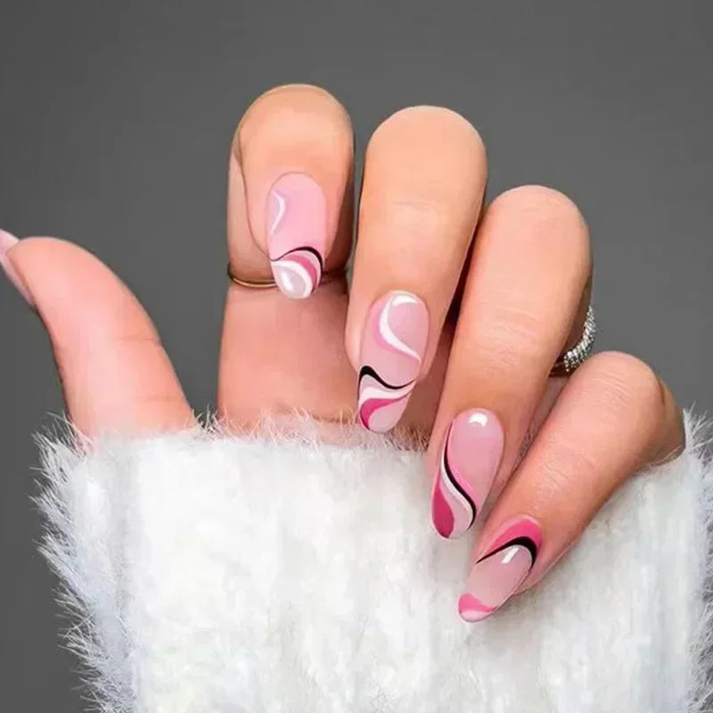 Hand with pink and black wavy nail art on a gray background, Obroi