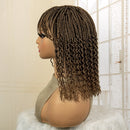 Mannequin head with a brown braided wig against a neutral background, Obroi
