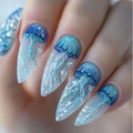 Nails with jellyfish design and blue glitter on a neutral background, Obroi