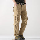 Person wearing beige cargo pants on a white background, Obroi
