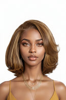 Woman with styled hair and gold jewelry on a white background, Obroi