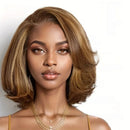 Woman with styled hair and gold jewelry on a white background, Obroi