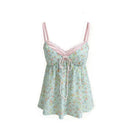 A light green floral print camisole top with thin pink straps, a pink lace-trimmed neckline, and a white drawstring tie at the center front, shown against a plain white background, Obroi