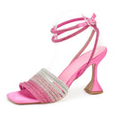 Pink high-heeled sandal with rhinestone detailing on a white background, Obroi