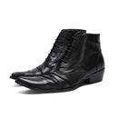 Pair of black leather ankle boots on a white background