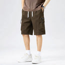Person wearing brown cargo shorts on a white background, Obroi