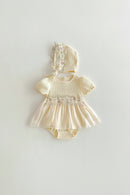 Baby dress with floral embroidery and matching bonnet on a light gray background, Obroi