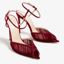 Red high-heeled shoes with open toes and ankle straps on a white background, Obroi