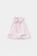 Pink baby dress with a bow on a light gray background, Obroi