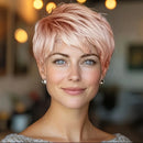 Woman with short pink hair in a blurred indoor setting, Obroi