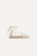 White espadrille sandal with jute sole on a white background, Obroi