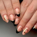 Nails with black, gold, and pink design on a neutral background, Obroi