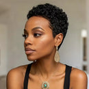 Woman with styled hair wearing earrings and a necklace against a neutral background, Obroi