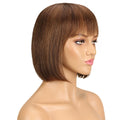 Mannequin head with a brown bob wig on a white background, Obroi