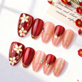 Set of red and pink nail designs with floral and decorative elements on a white background, Obroi
