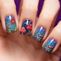Nails with colorful mushroom and flower design on a blue background, Obroi