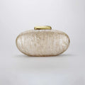 Oval-shaped clutch with a gold top on a light gray background, Obroi