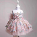 Pink floral dress on a mannequin against a gray background, Obroi