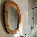 Wooden framed mirror on a wall with a blurred background, Obroi