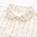 Obroi White blouse with floral pattern on a white background