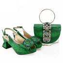 Green high-heeled shoes and matching handbag with decorative elements on a white background, featuring 'Obroi' branding.