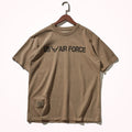 Brown t-shirt with 'US Air Force' text on a hanger against a white background, Obroi