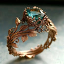 Obroi Ornate ring with green gemstone and rose gold design on a soft background