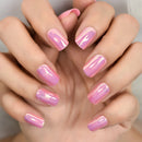 Close-up of hands with pink nail polish on a neutral background, Obroi
