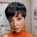 Woman with a stylish haircut wearing an orange top indoors, Obroi