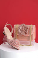 Pink high heel shoe and matching handbag with floral design on a red background, Obroi
