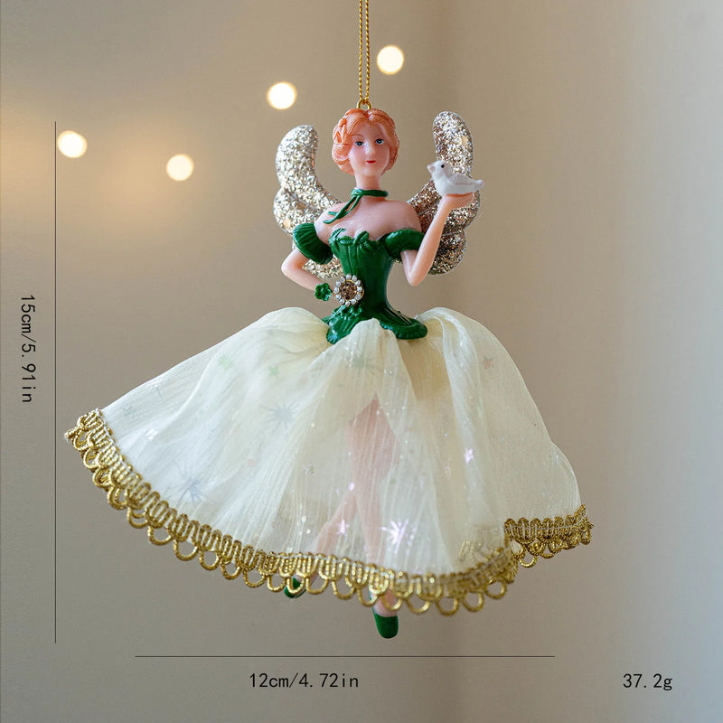 Decorative angel figurine with green dress and white wings on a beige background, Obroi