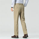 Beige pants worn by a person on a light gray background, Obroi