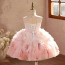 Pink floral dress on a mannequin against a neutral wall, Obroi