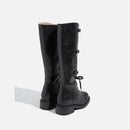 Black knee-high boots on a white background, Obroi