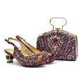 A matching women's evening shoe and handbag set in deep burgundy, covered in intricate silver and white beading with red crystal accents, gold-tone hardware, and slingback/strap details, photographed on a clean white background, Obroi