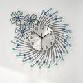 Decorative wall clock with floral design and blue accents on a white background, Obroi