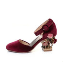 Maroon velvet shoe with floral design on a white background, Obroi