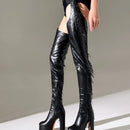 Black leather thigh-high boots with fringe details on a neutral background, Obroi