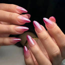 Close-up of hands with pink gradient nail polish on a blurred background, Obroi
