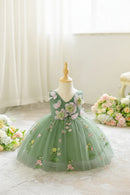 Green floral dress on a mannequin with flowers in the background, Obroi